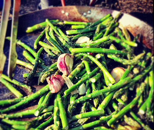 Jason grilling asparagus on an open fire in Sicily last year.