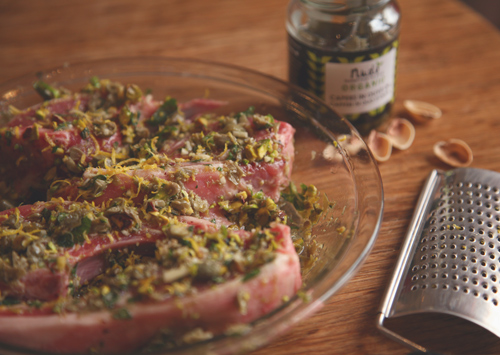 Lamb chops marinating in pistachio, mint olive oil, lemon juice, garlic and capers.